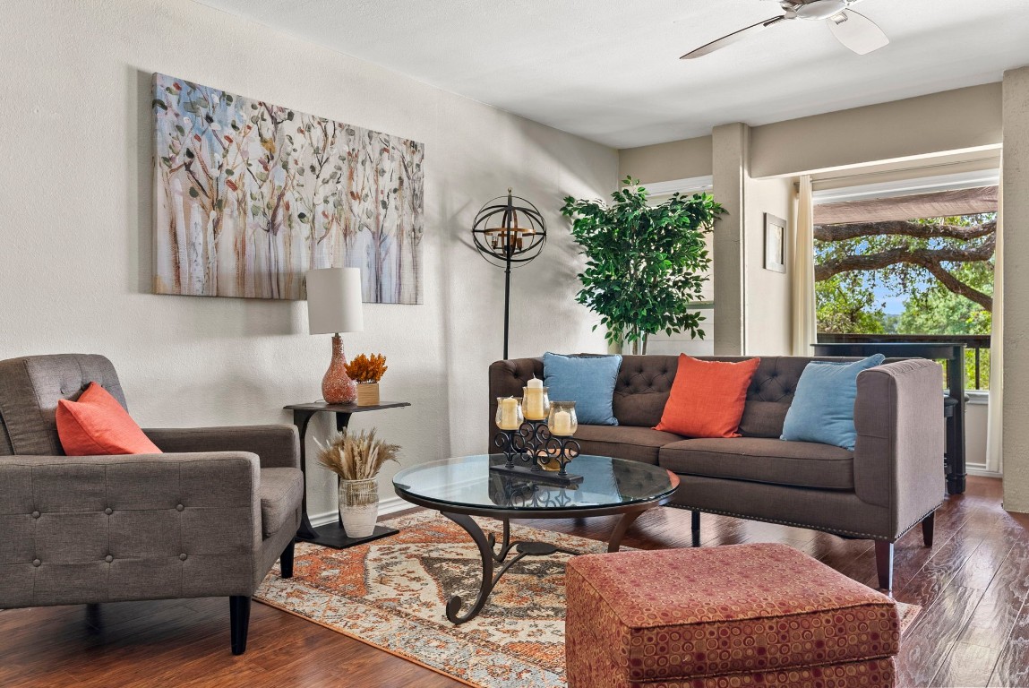 a living room with furniture and a large window