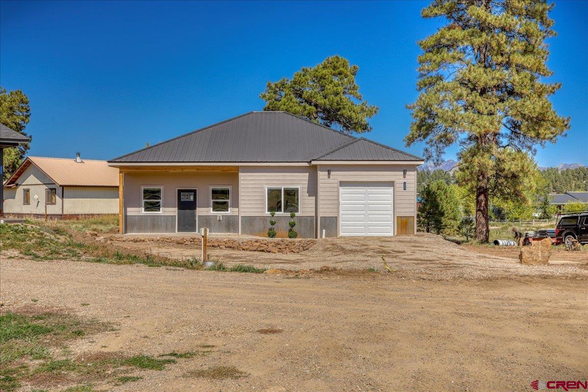 a house with trees in the background