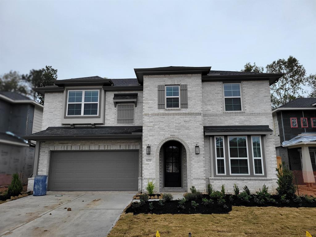 a front view of a house with yard