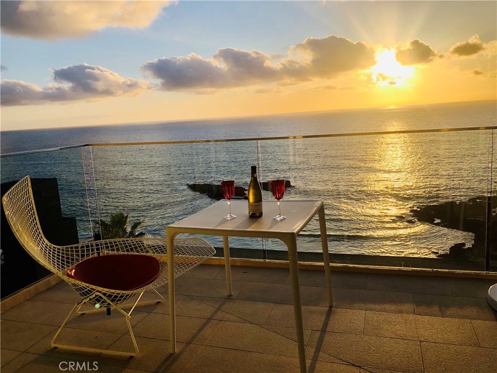 a terrace with outdoor seating and city view