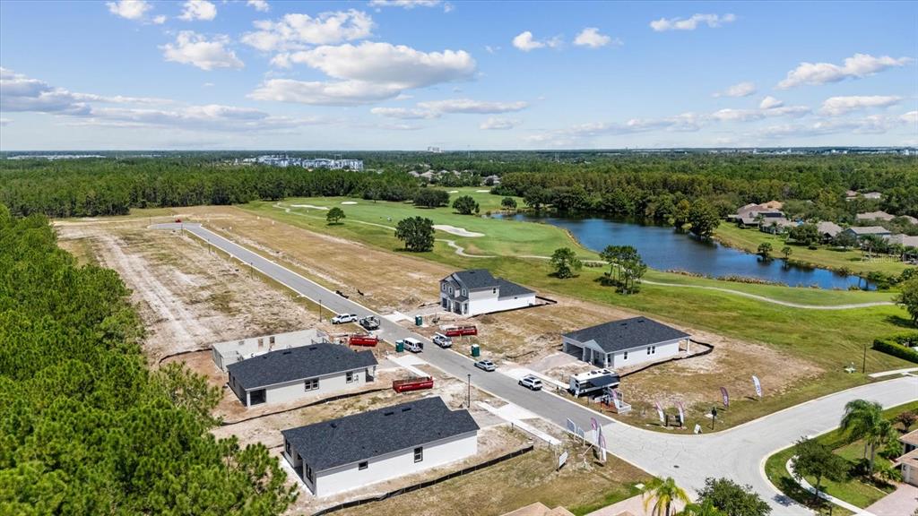 an aerial view of a houses with outdoor space