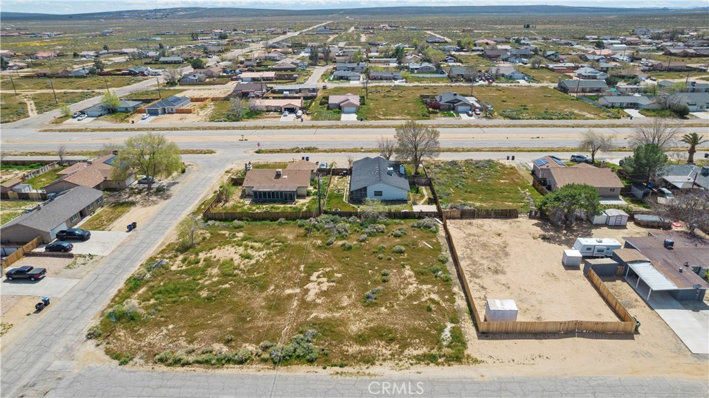 an aerial view of a residential houses with outdoor space