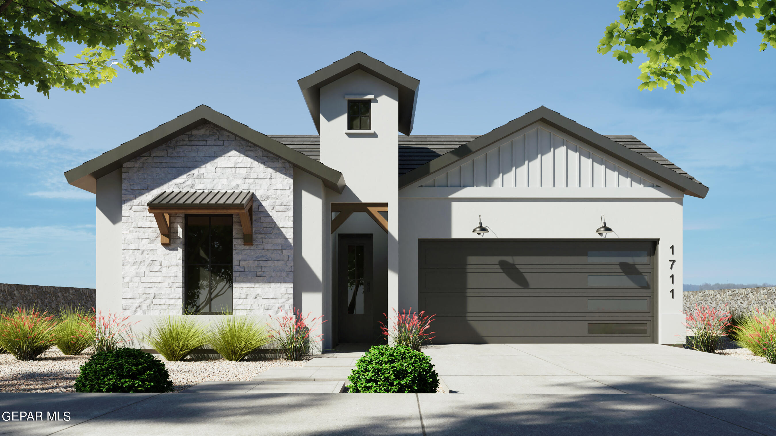 a front view of a house with garage and plants