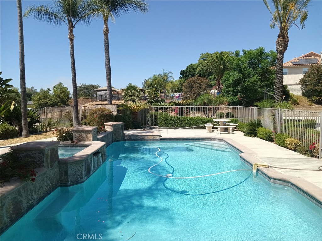 a view of a swimming pool with a patio