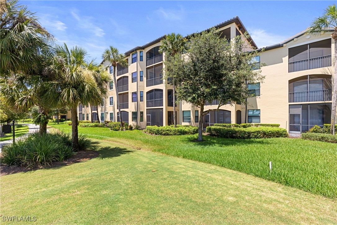 a view of a building with a yard