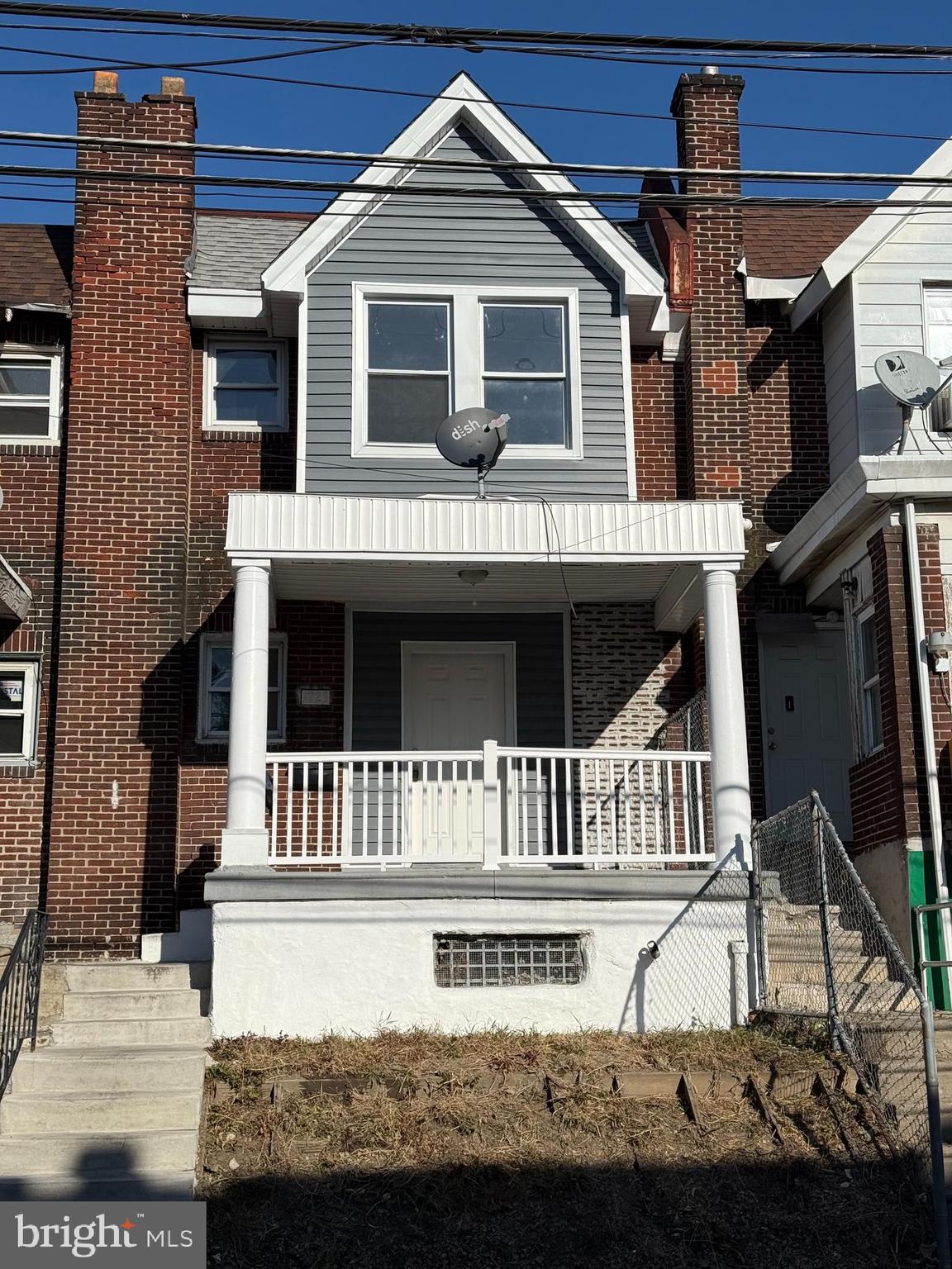 a front view of a house with a porch