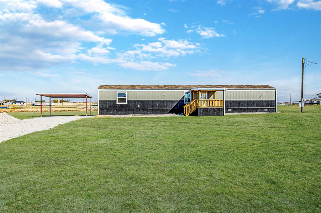 a view of a house with a big yard