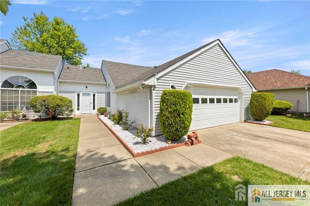 a view of a house with a yard