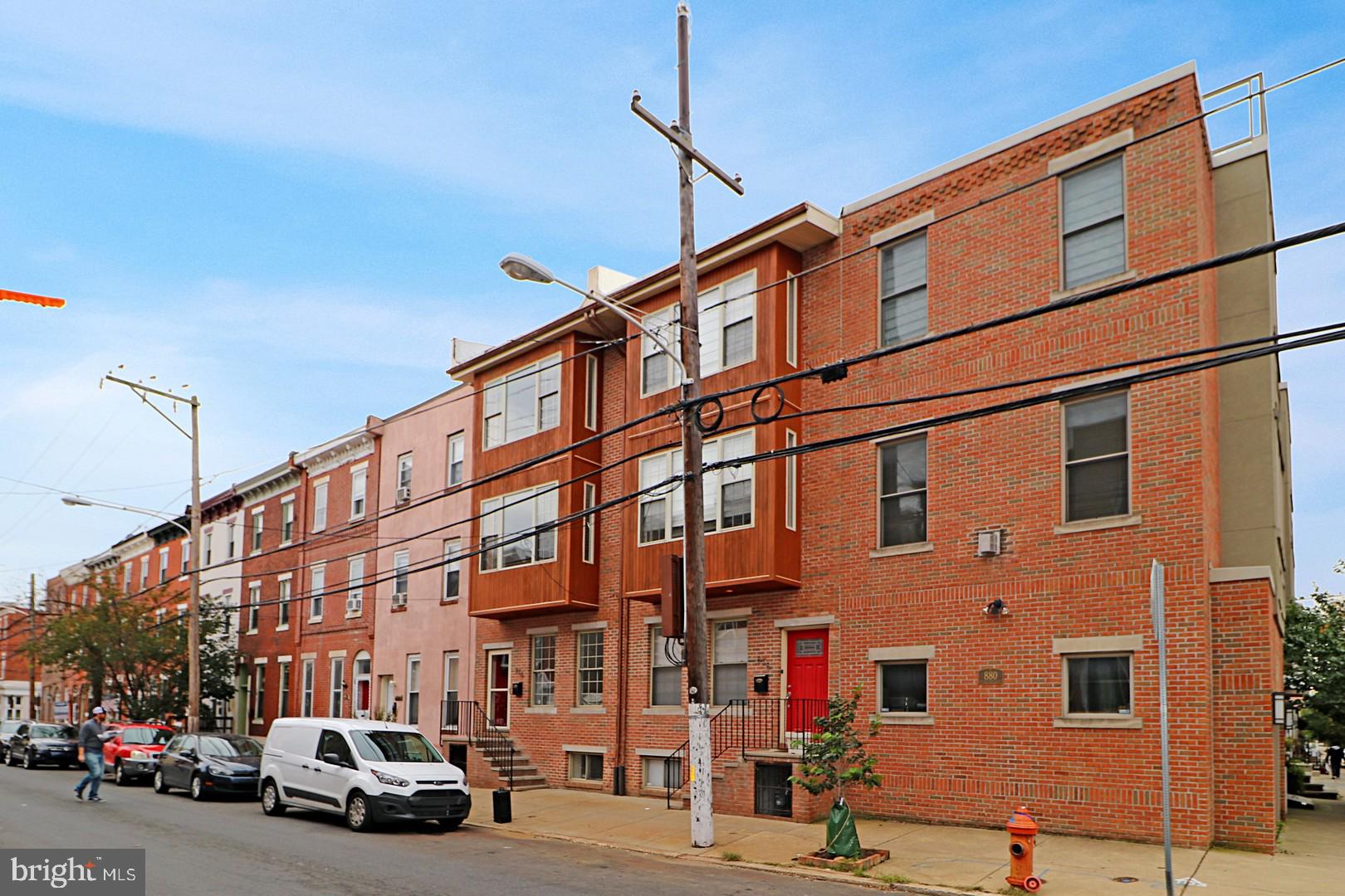 a view of a car parked in front of a building