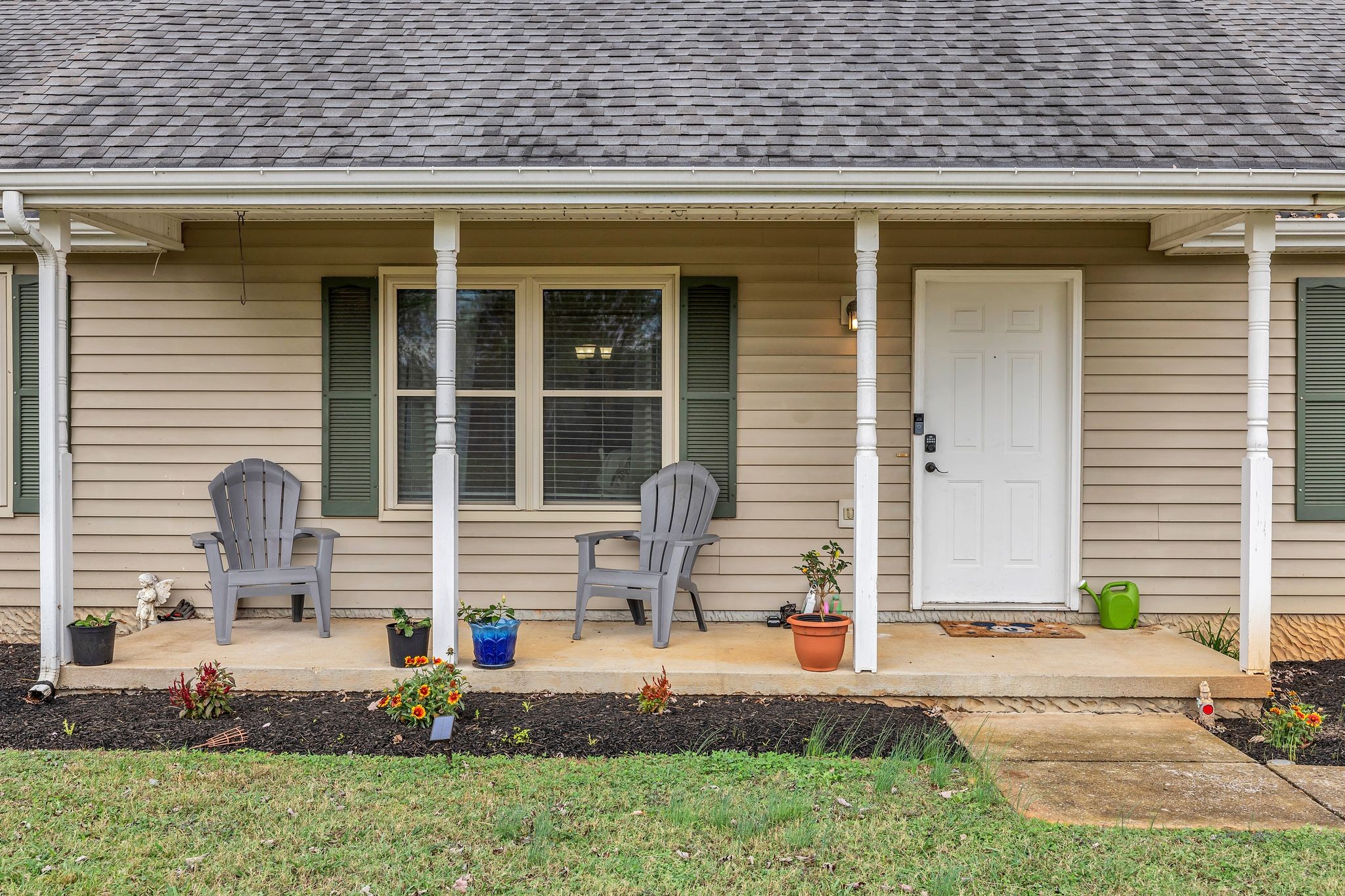 a front view of a house with garden