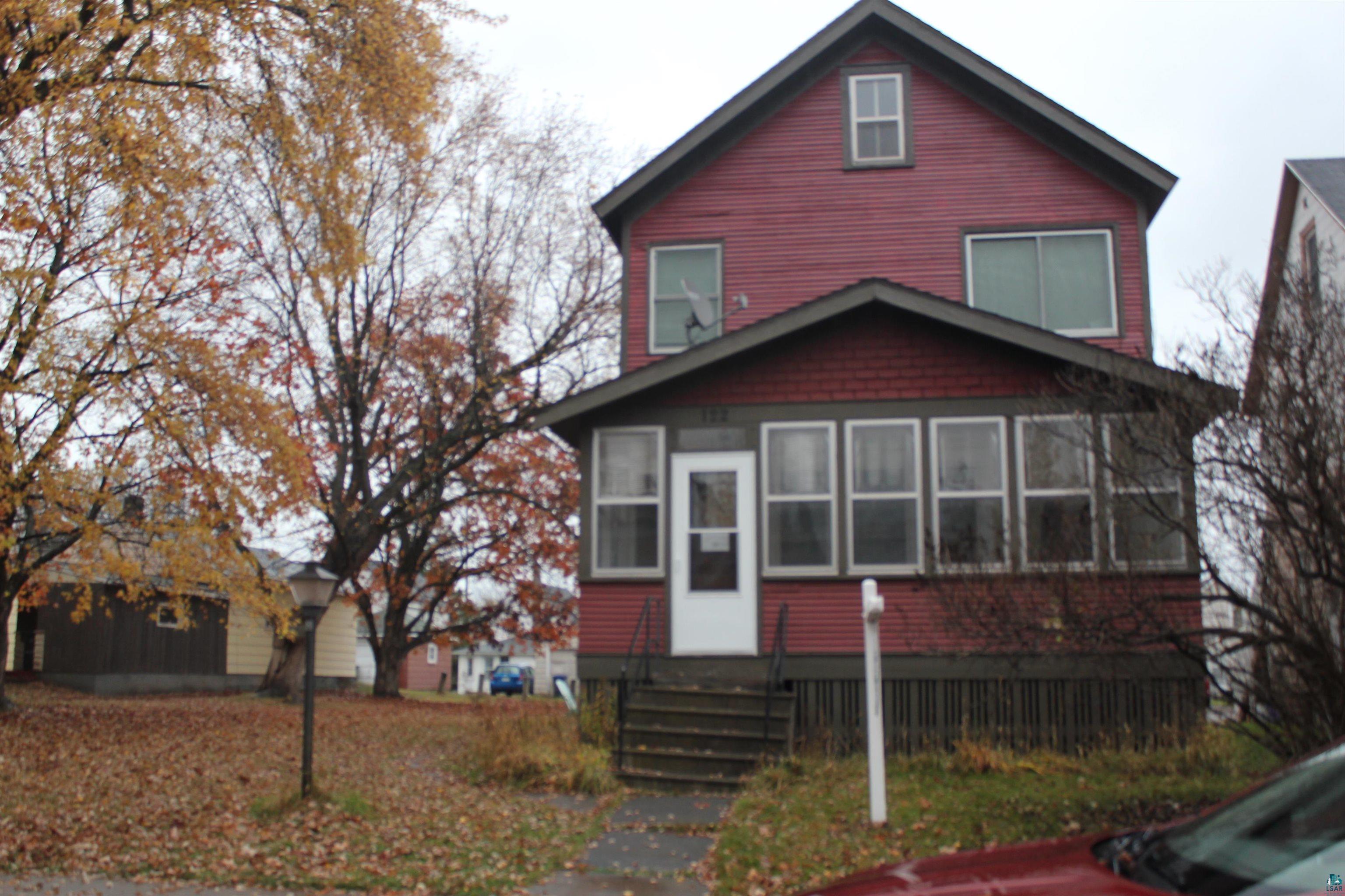 View of property featuring a sunroom