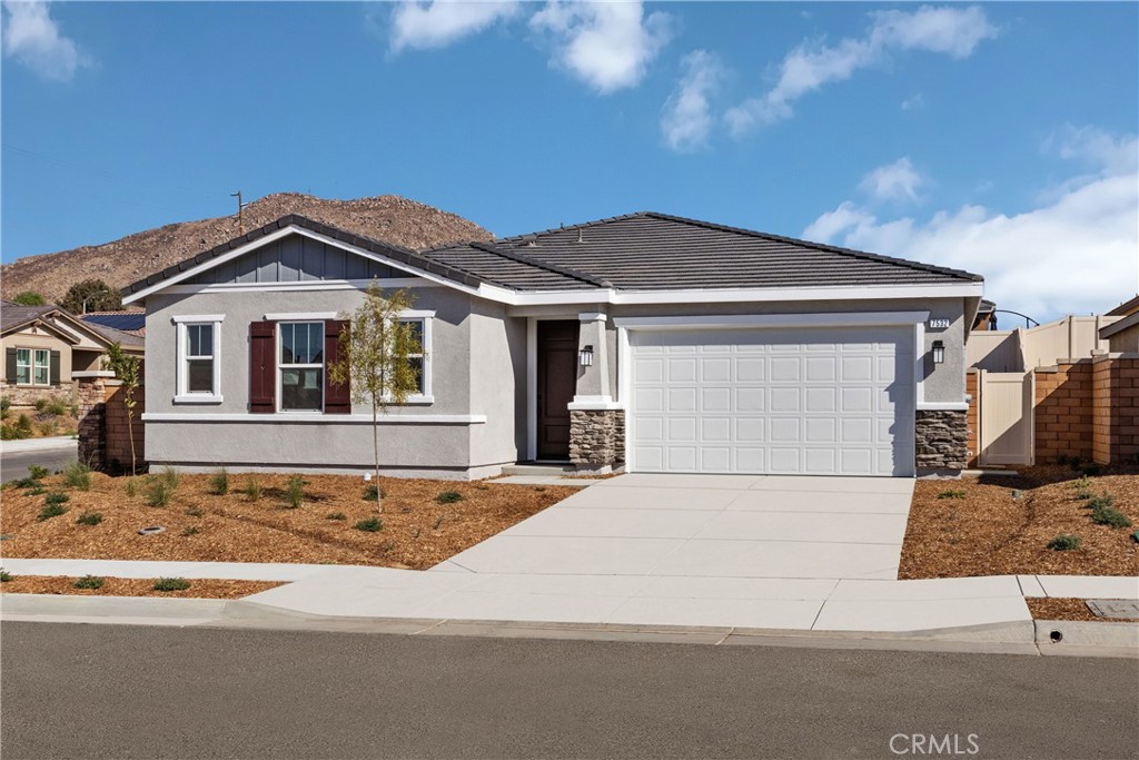 a front view of a house with a garage