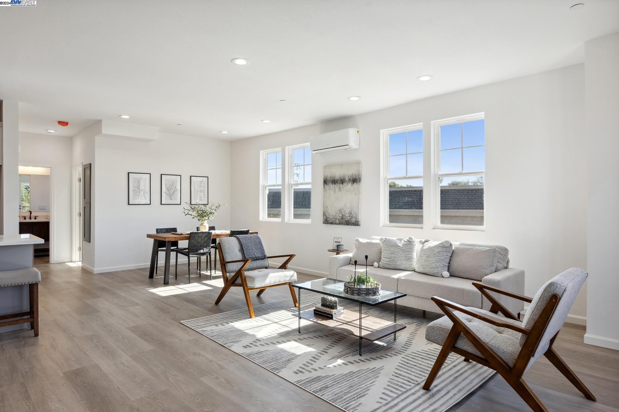 a living room with furniture and next to a window