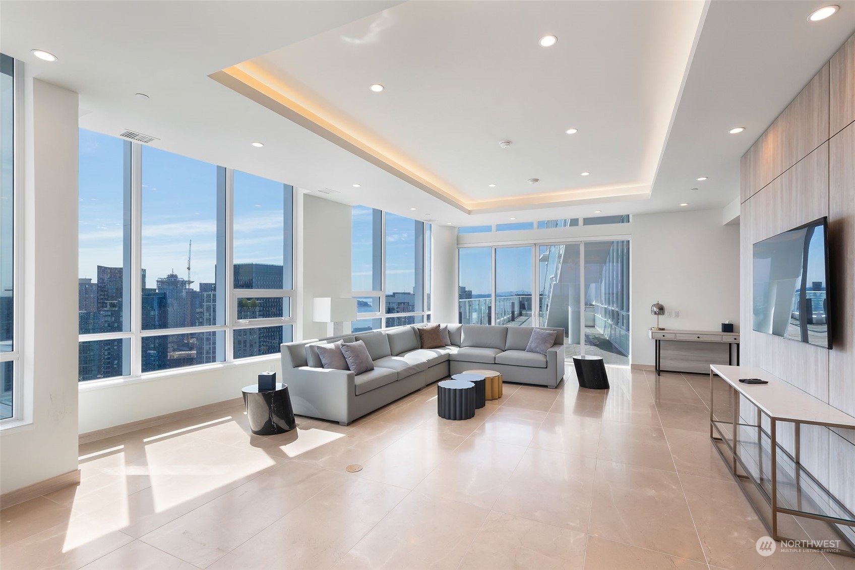 a living room with furniture and a flat screen tv