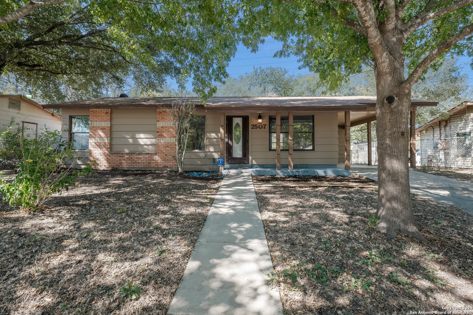 front view of a house with a yard