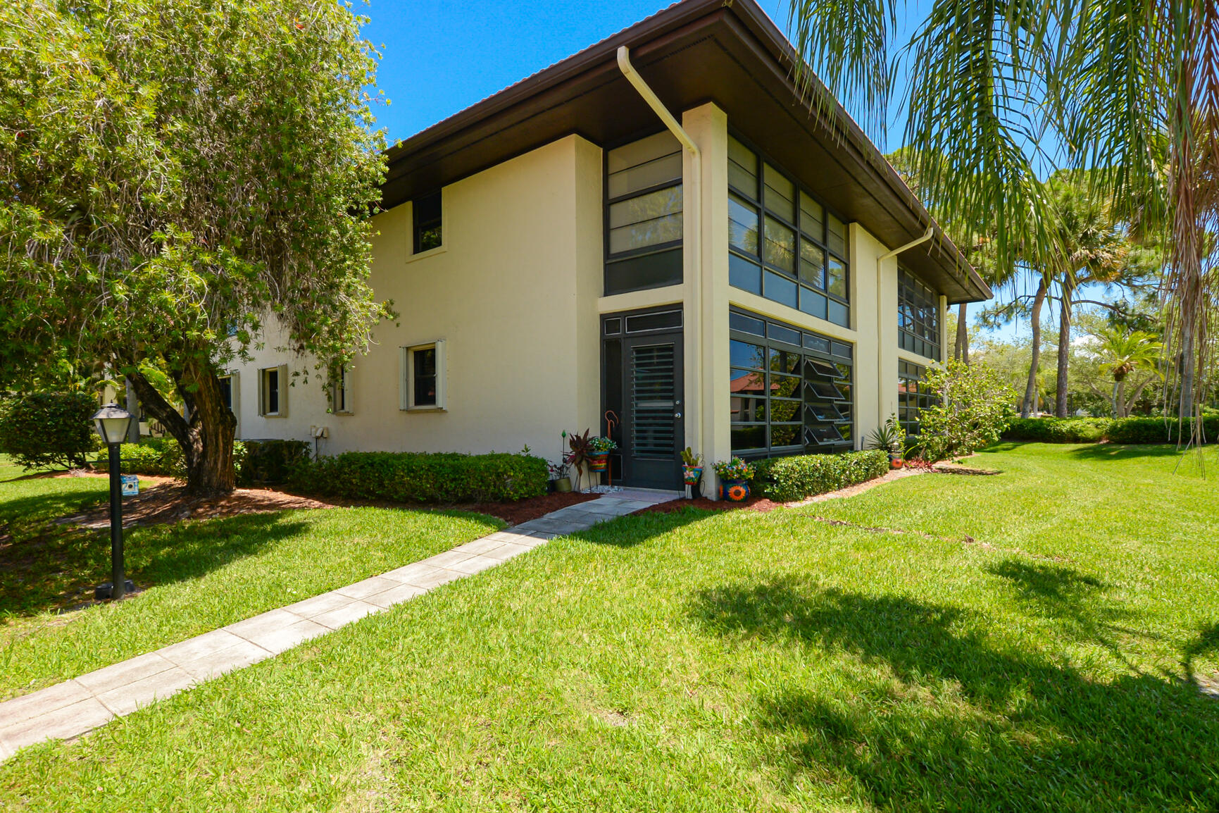 a view of house with yard