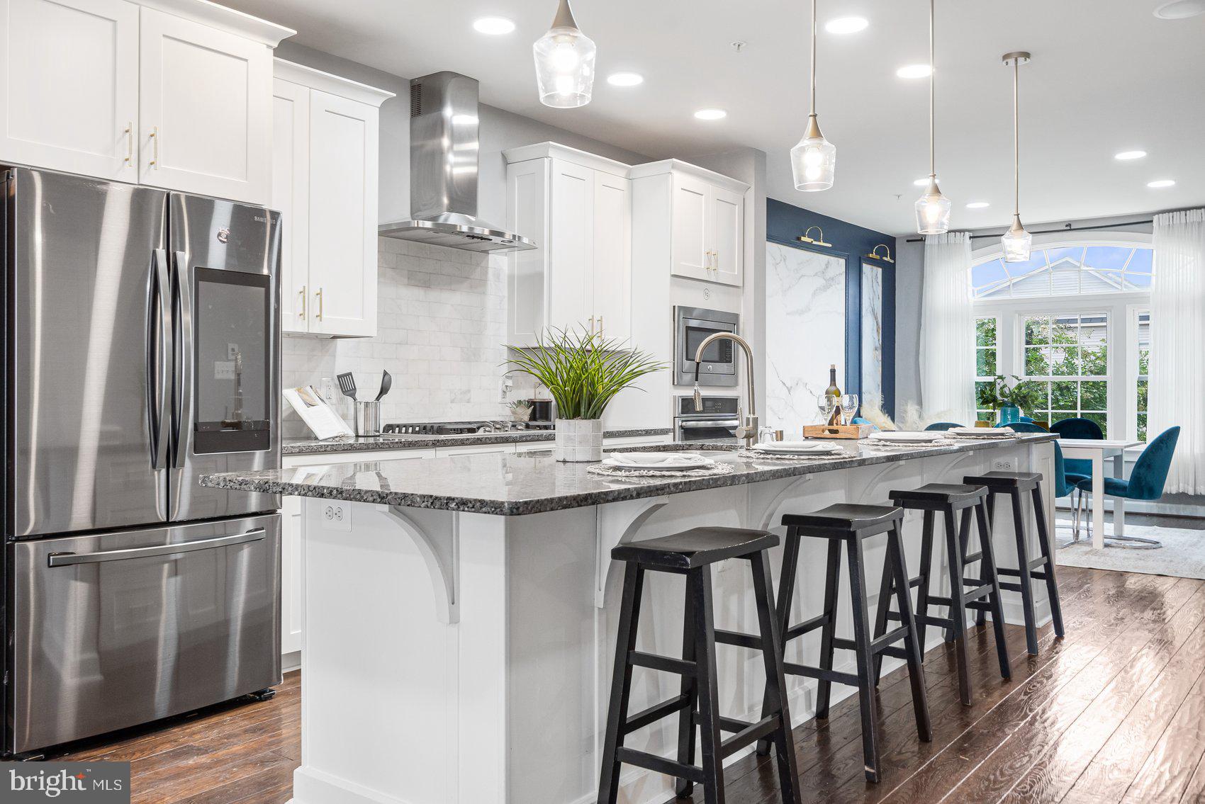 a kitchen with counter top space cabinets and stainless steel appliances