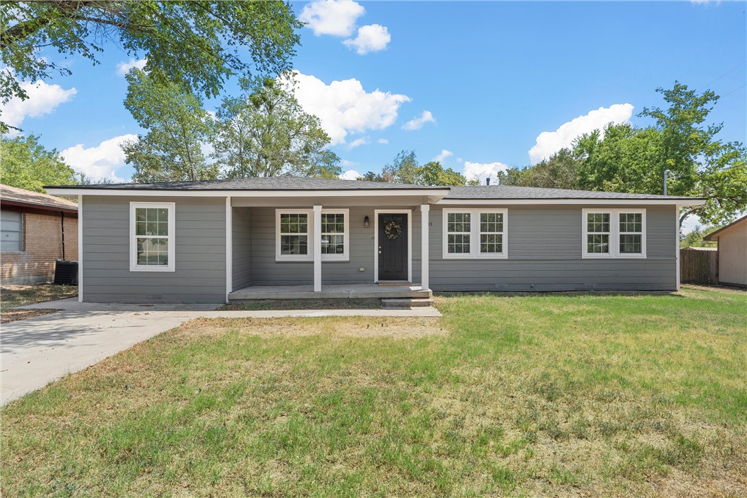 front view of a house with a yard