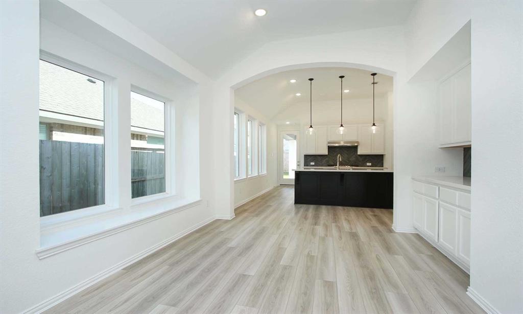 a view of a kitchen with a sink and cabinets