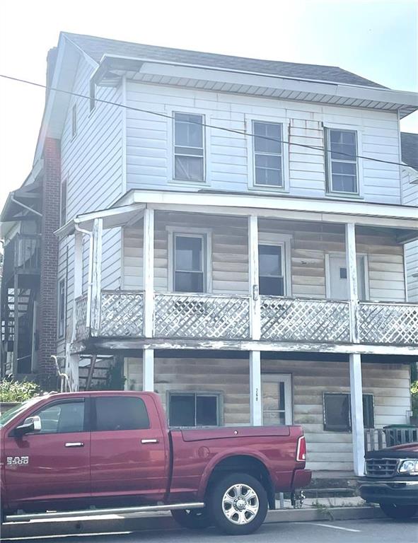 a front view of a house with parking