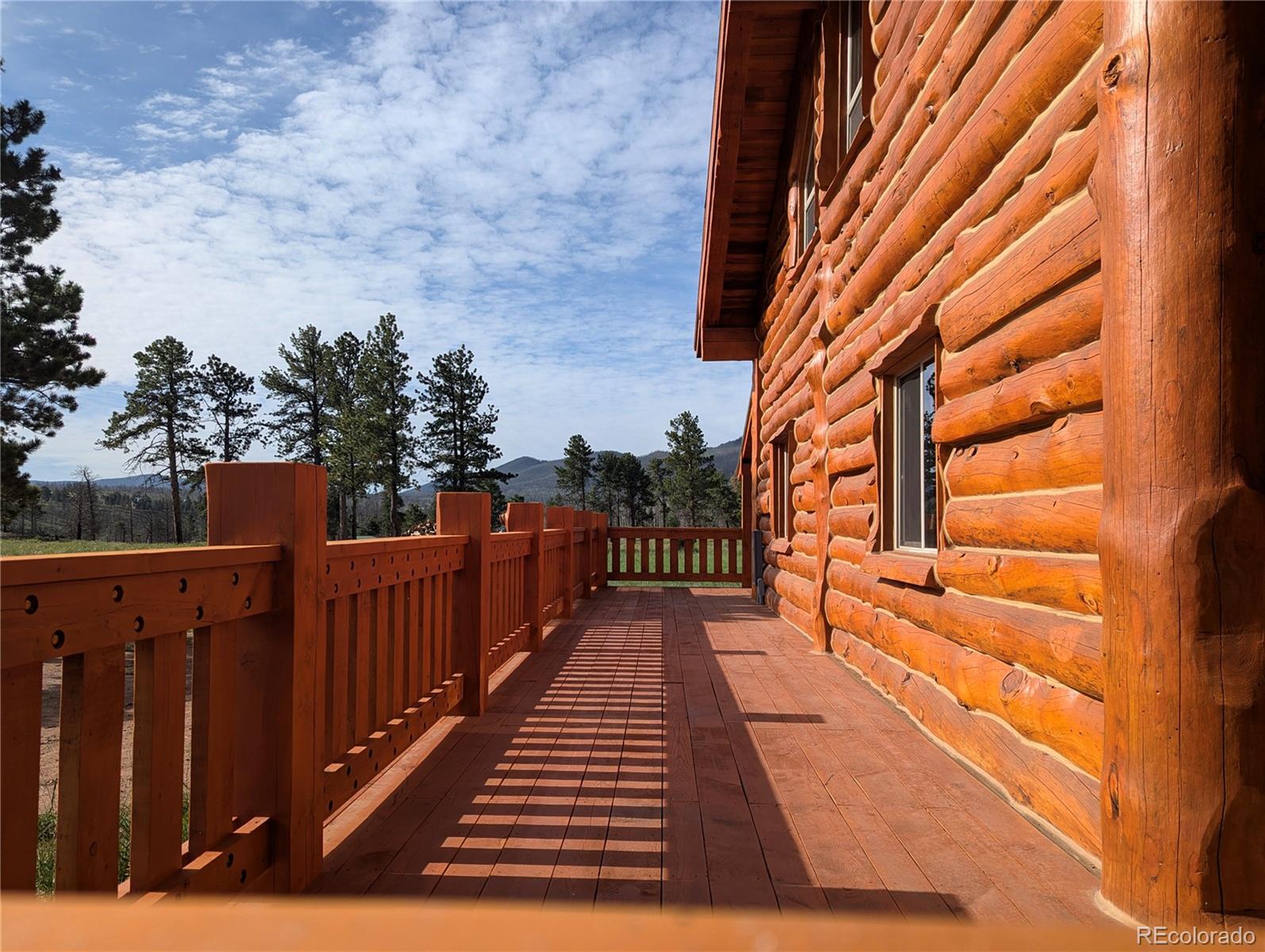 a view of deck with wooden floor and outdoor seating