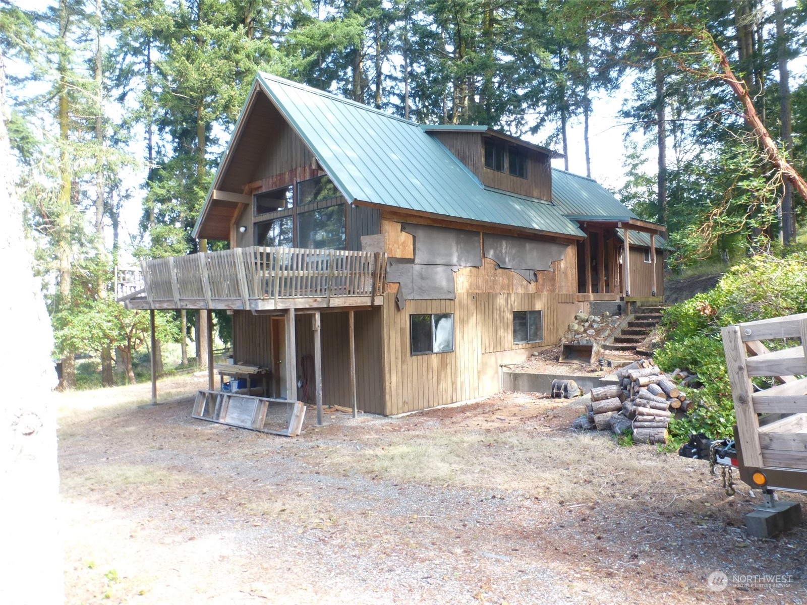 a view of a house with a yard and sitting area