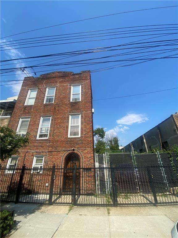 a view of a brick house with a outdoor space