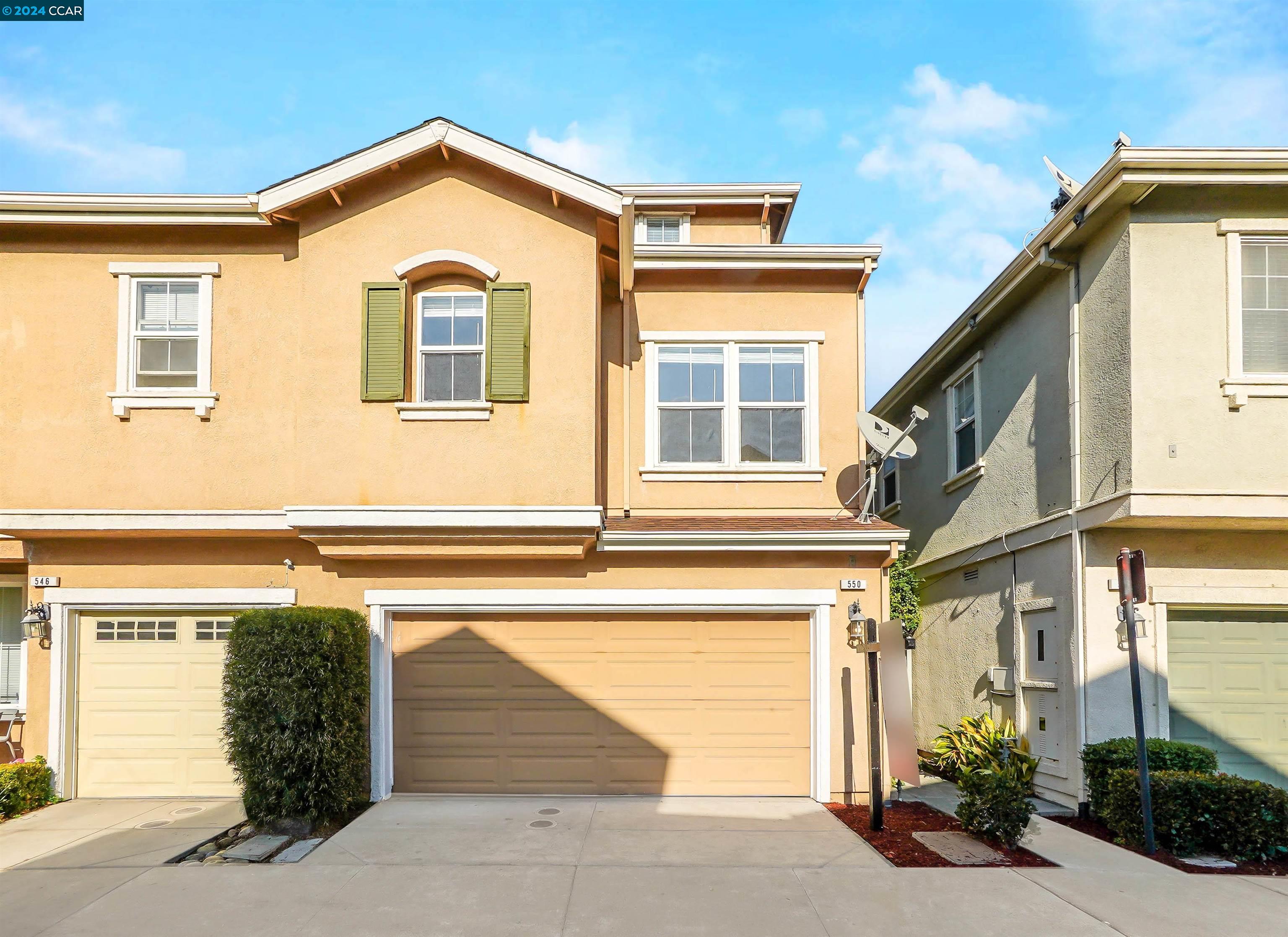 a front view of a house with a garage