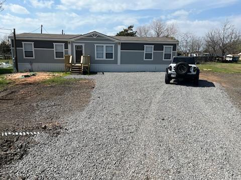 a front view of a house with yard