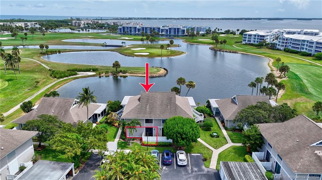 an aerial view of a house with a swimming pool outdoor seating and yard