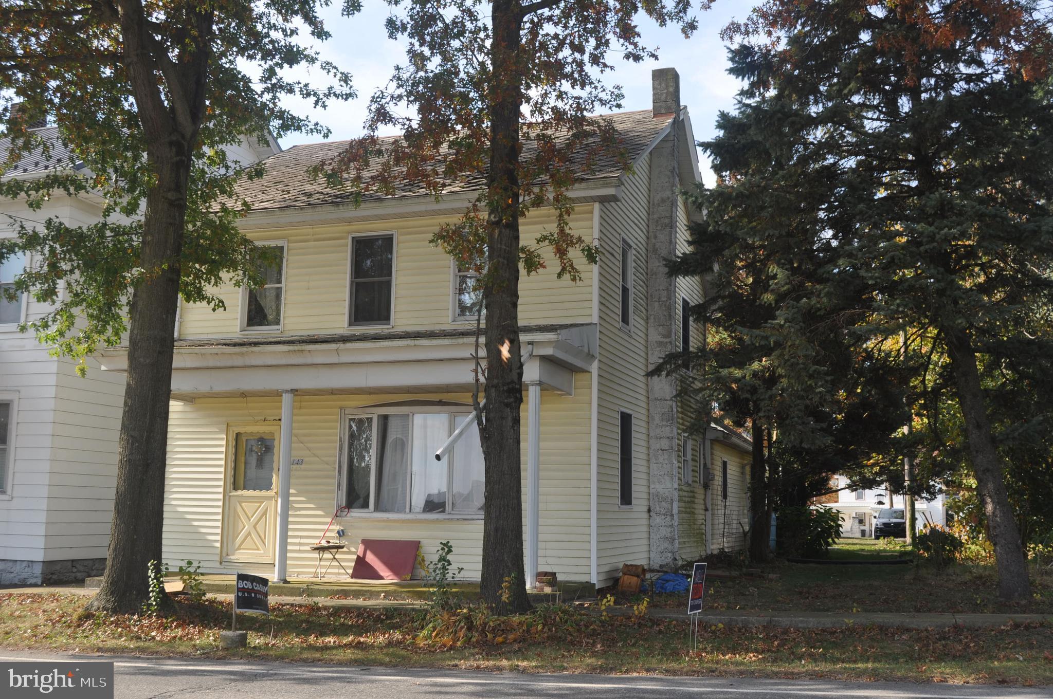 front view of a house with a tree