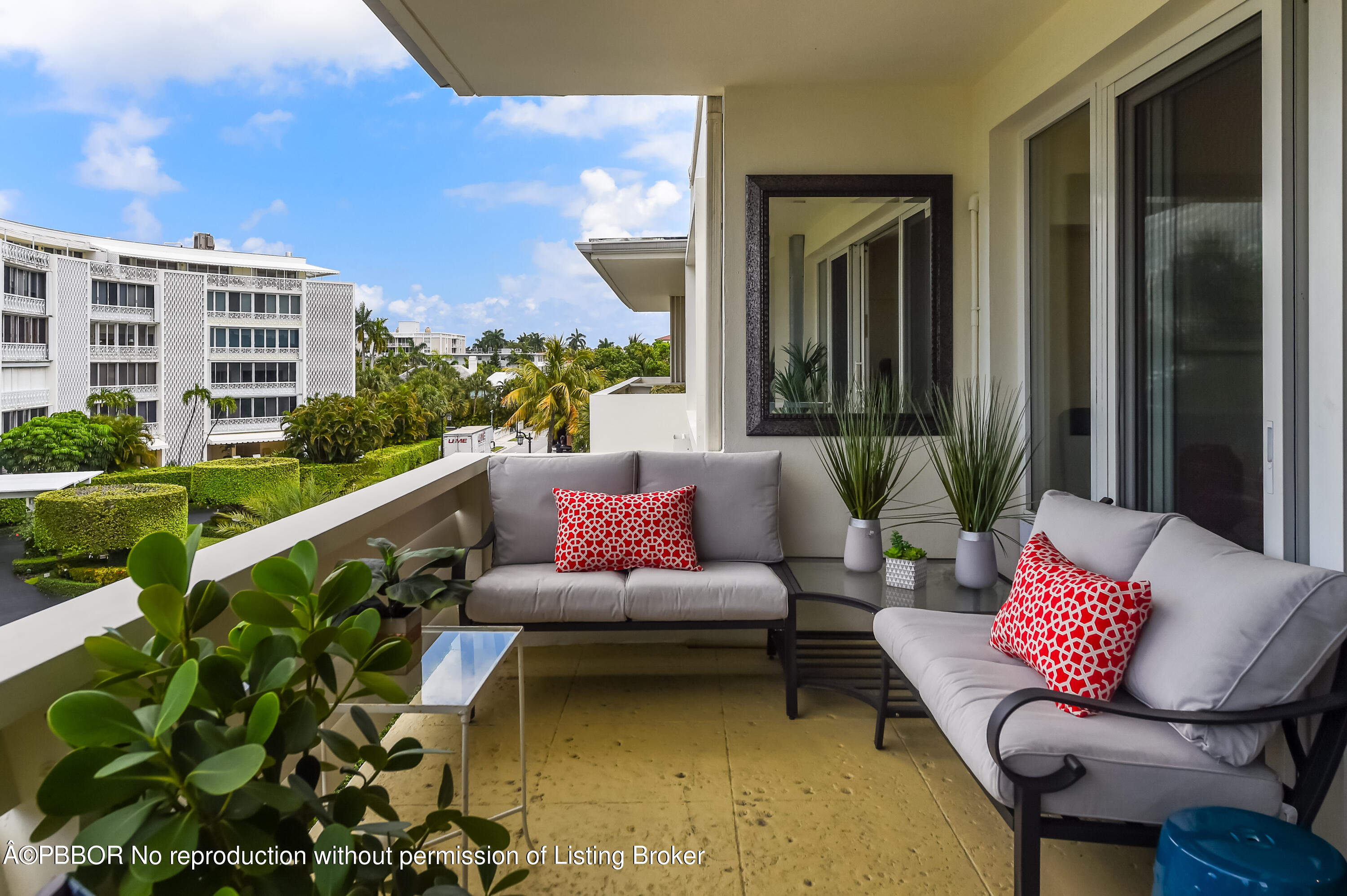 a outdoor living space with furniture and a potted plant