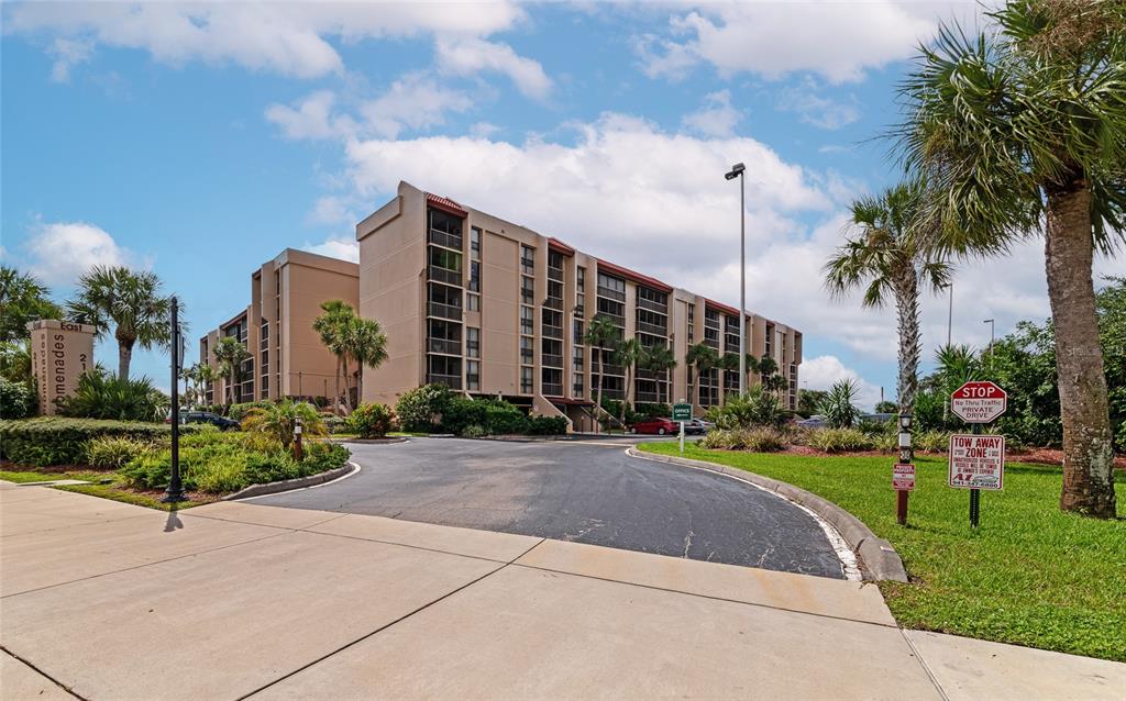 a view of a building with a yard