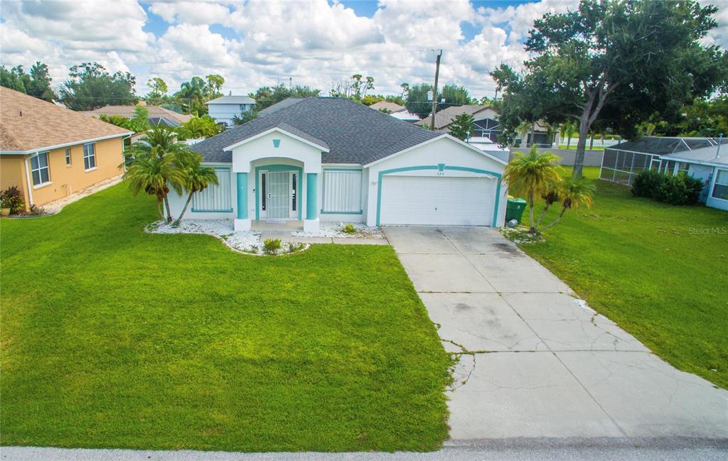 a front view of a house with garden