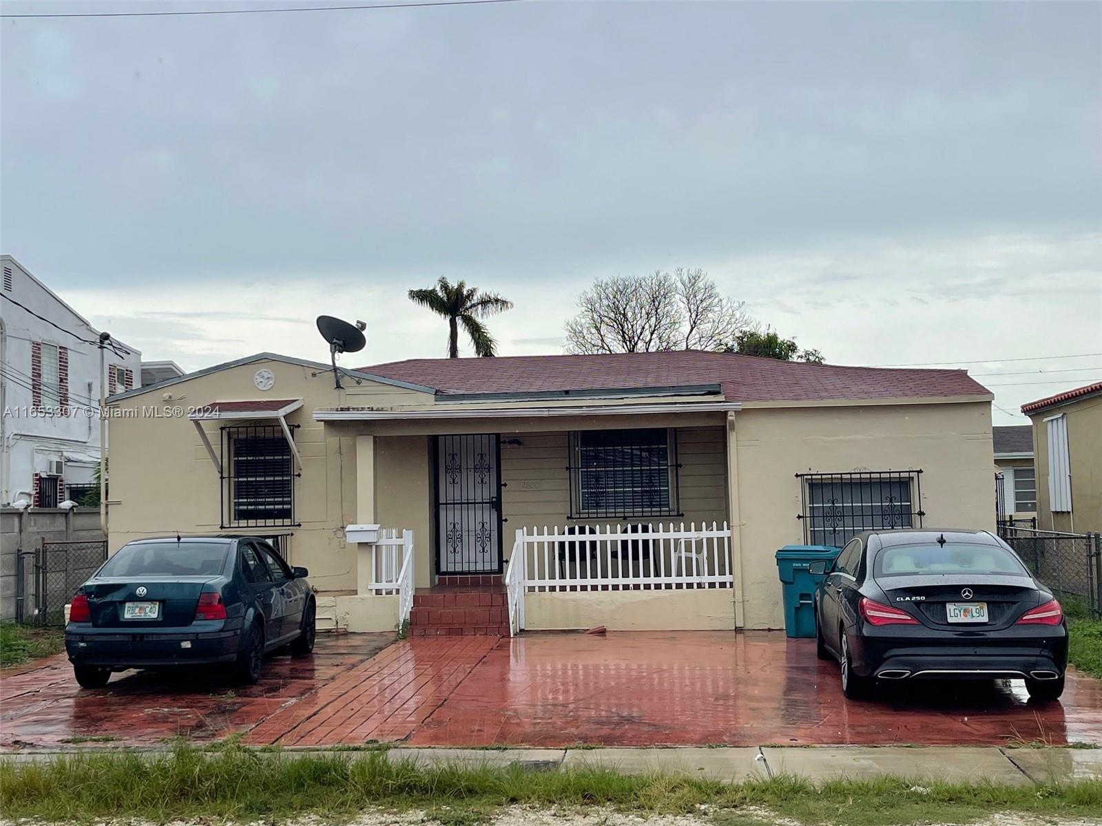 a car parked in front of a house