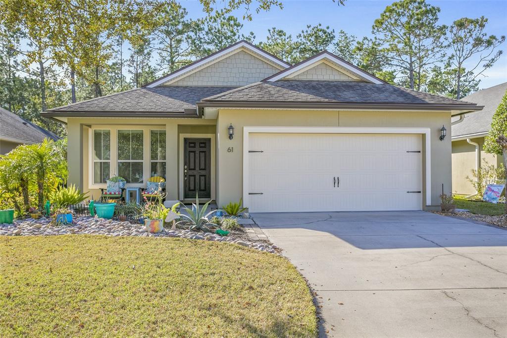 a front view of a house with garden