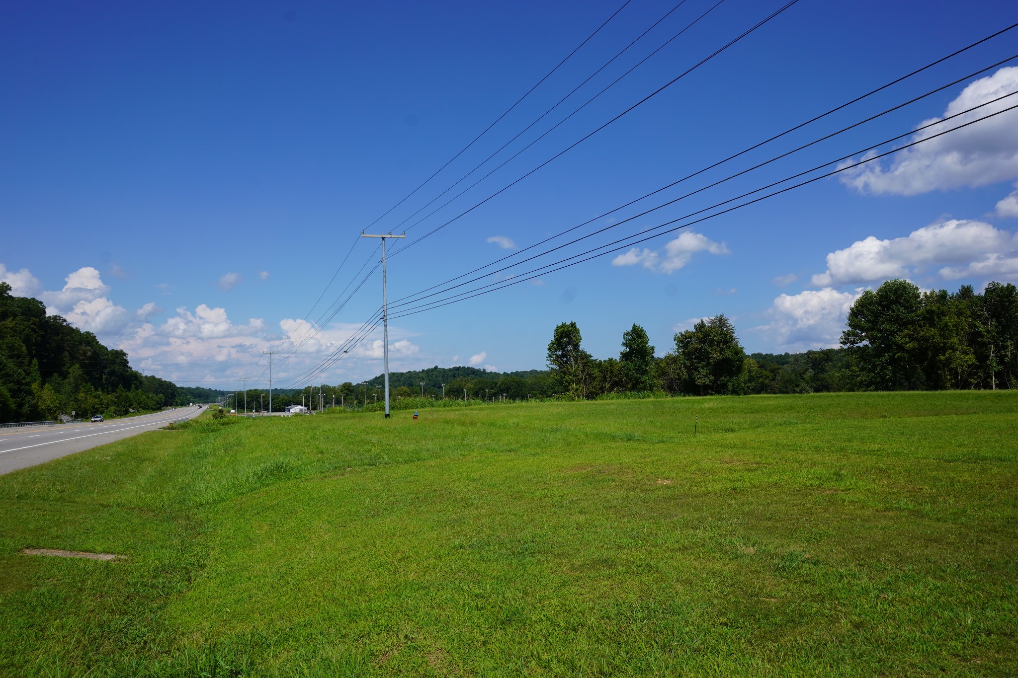 a view of a field of grass and a building