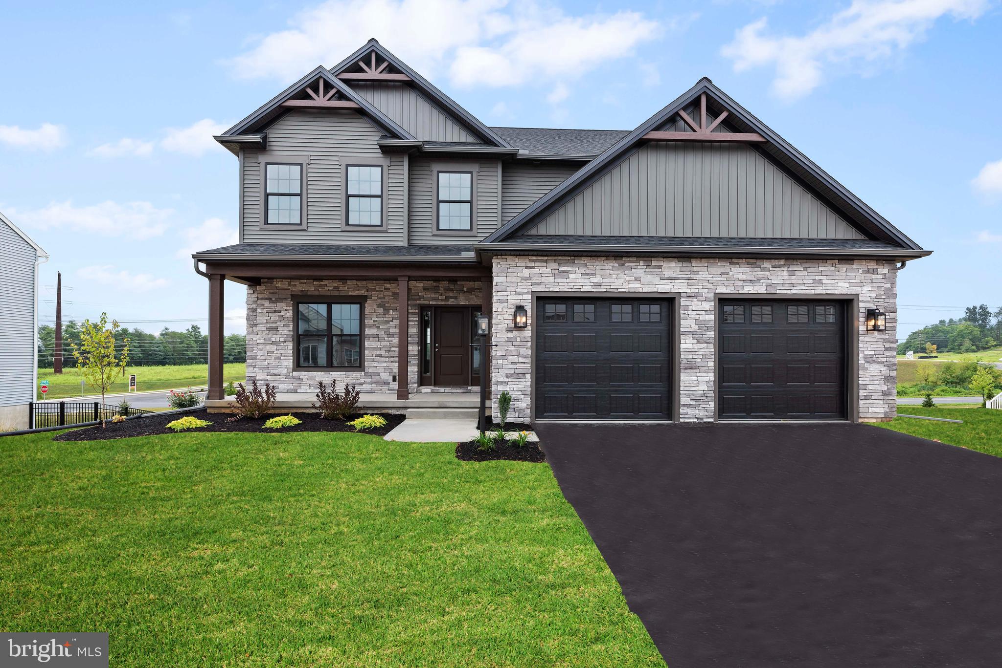 a view of a house with a yard patio and a yard