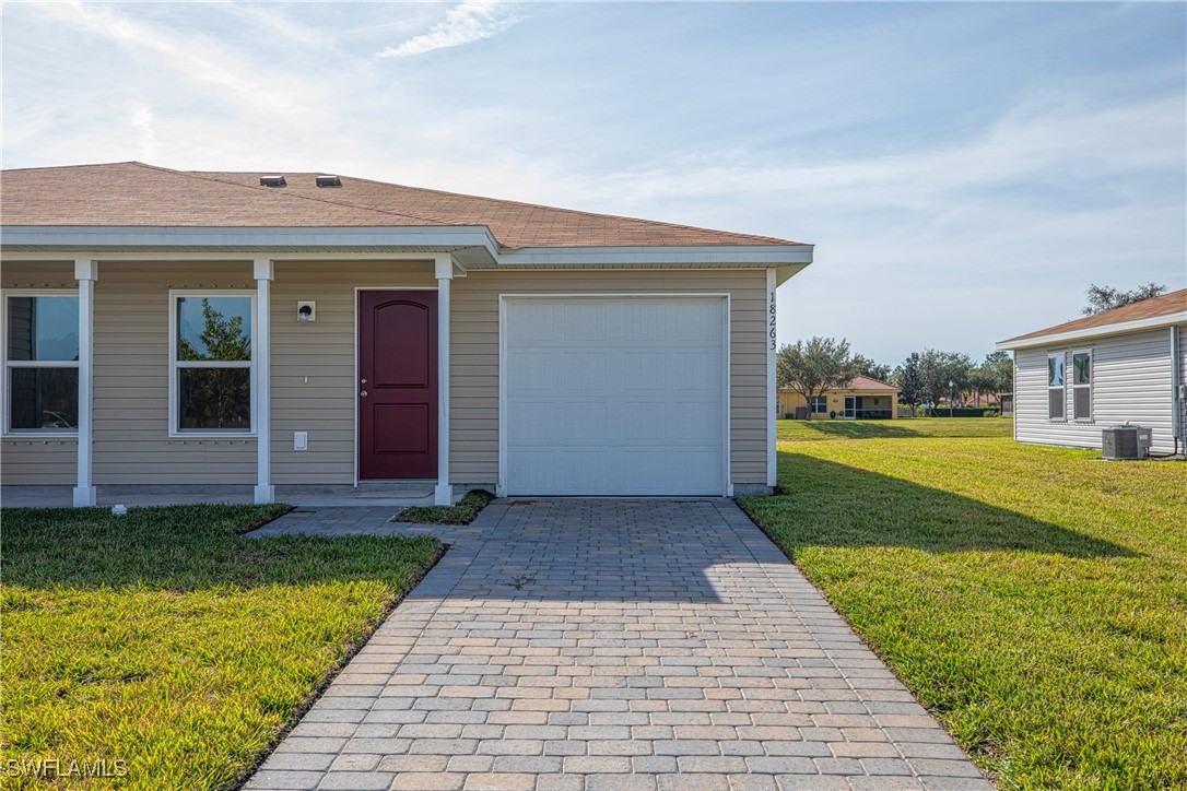 a view of a house with a yard