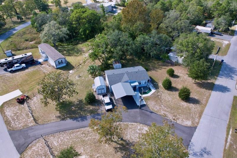 an aerial view of a house with outdoor space