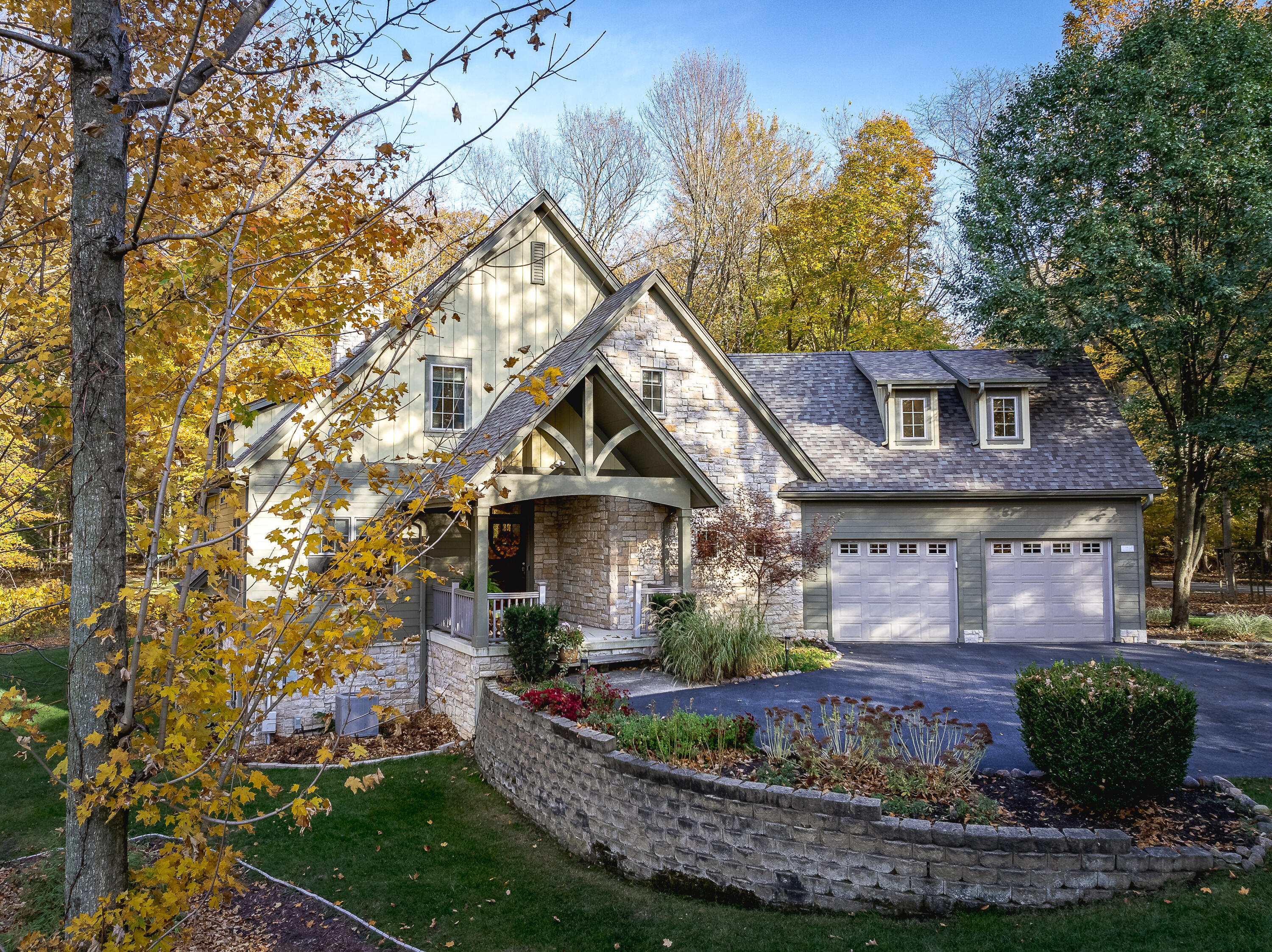 a front view of a house with a yard fountain