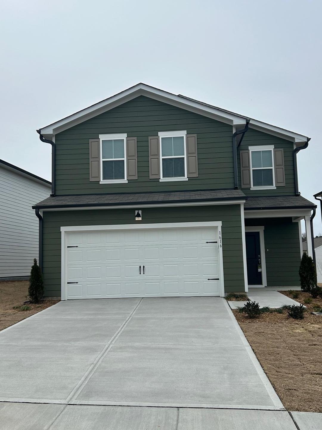 a view of a house with parking space