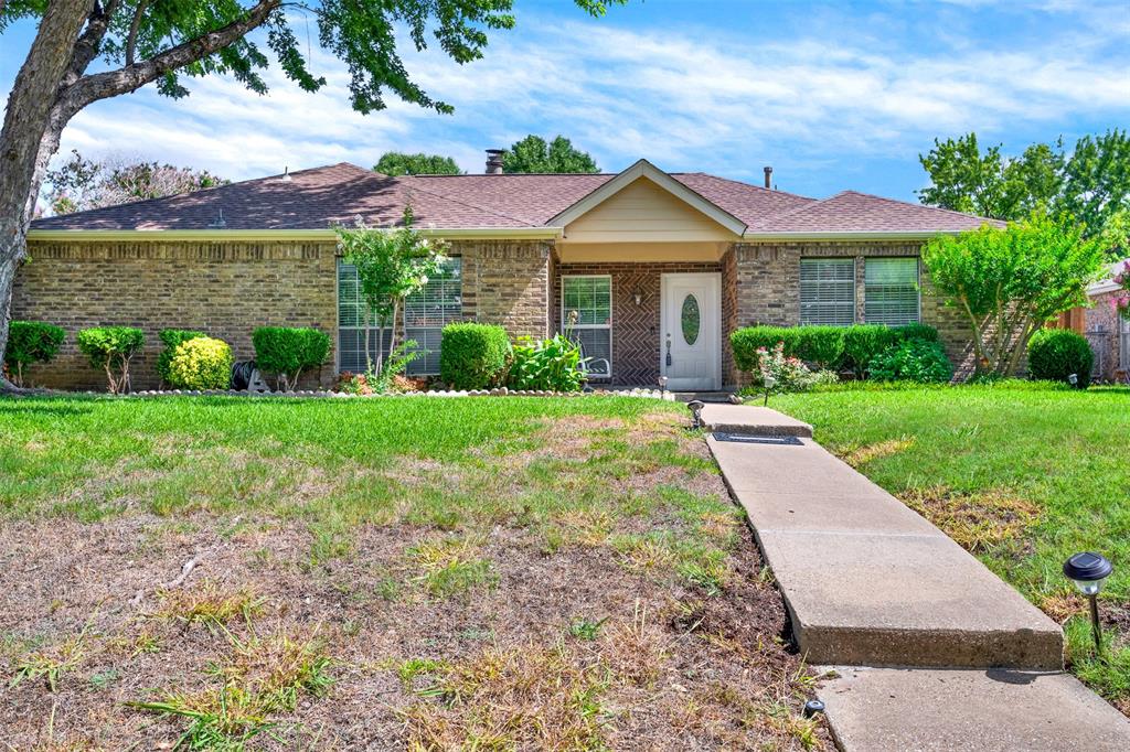 front view of a house with a yard