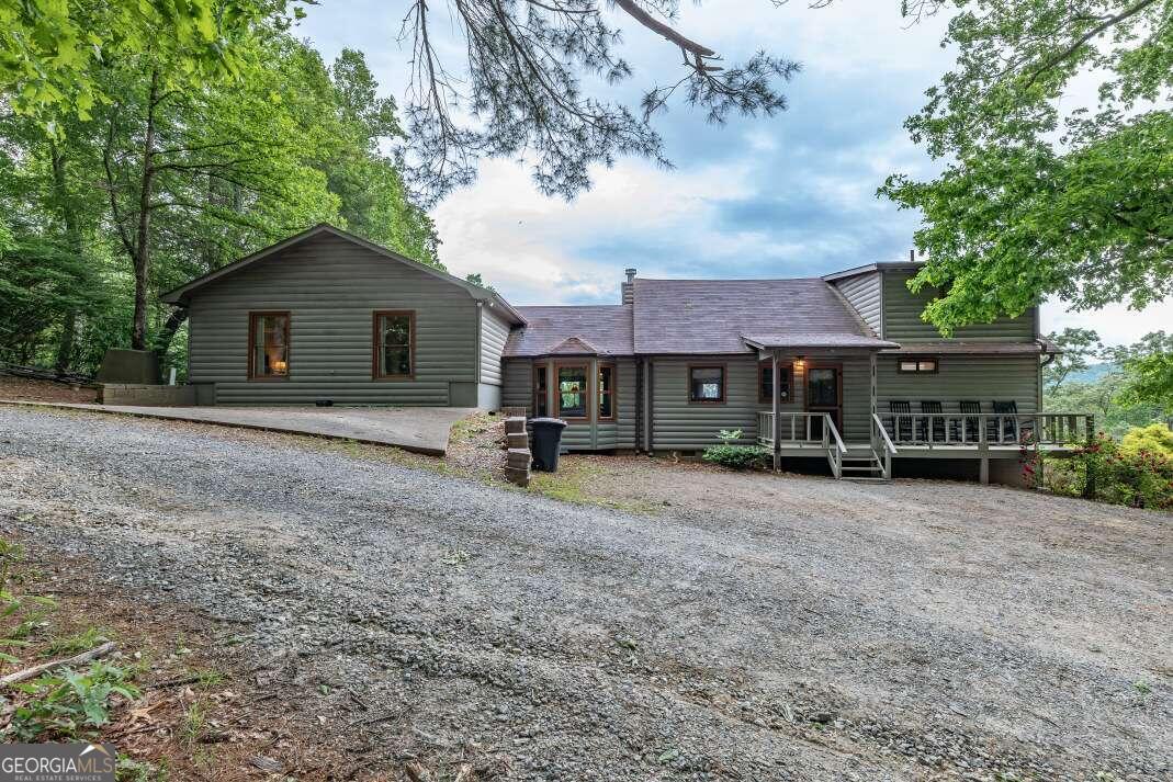 a view of house with a yard