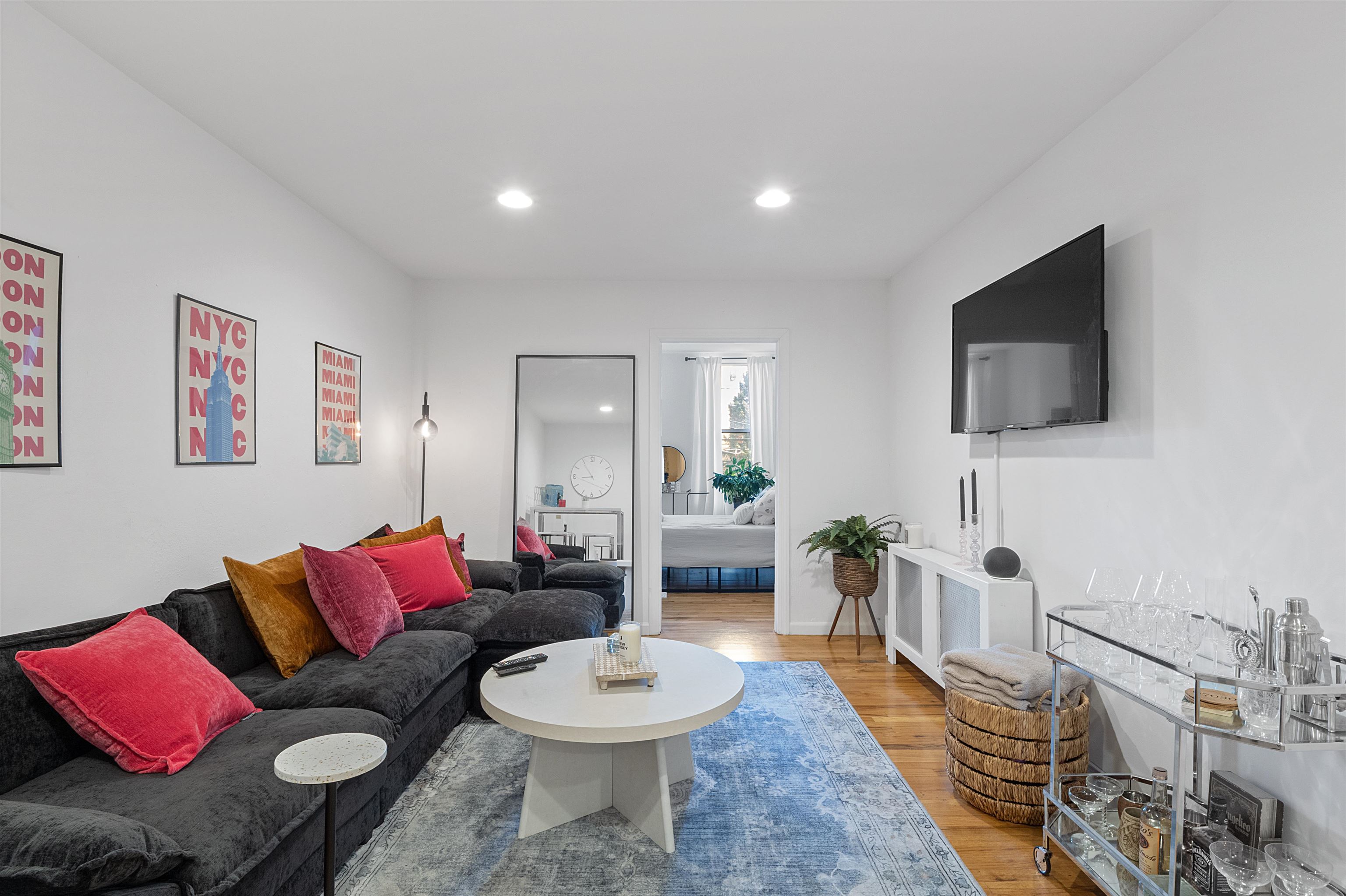 a living room with furniture and a flat screen tv