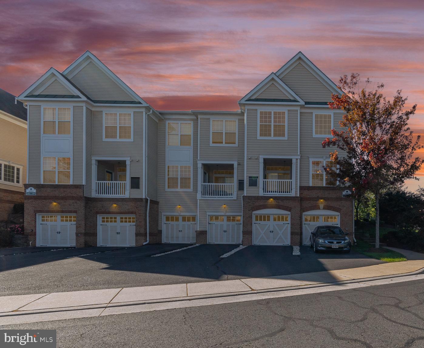 a front view of a residential apartment building with a yard