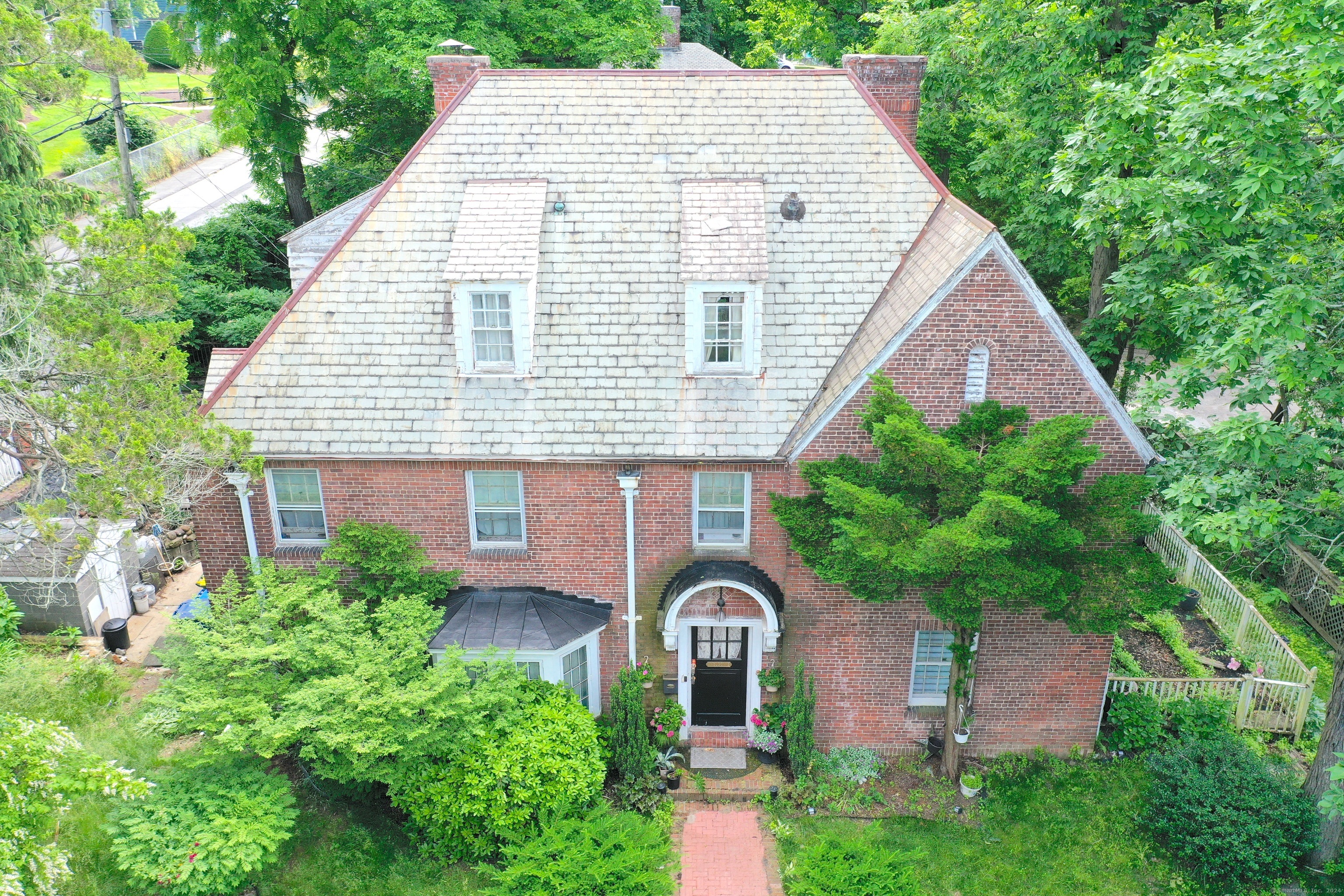 a view of a house with garden and plants