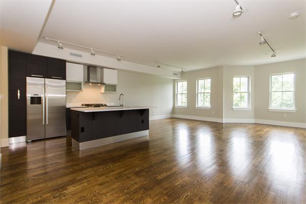 a kitchen with stainless steel appliances a refrigerator and a sink