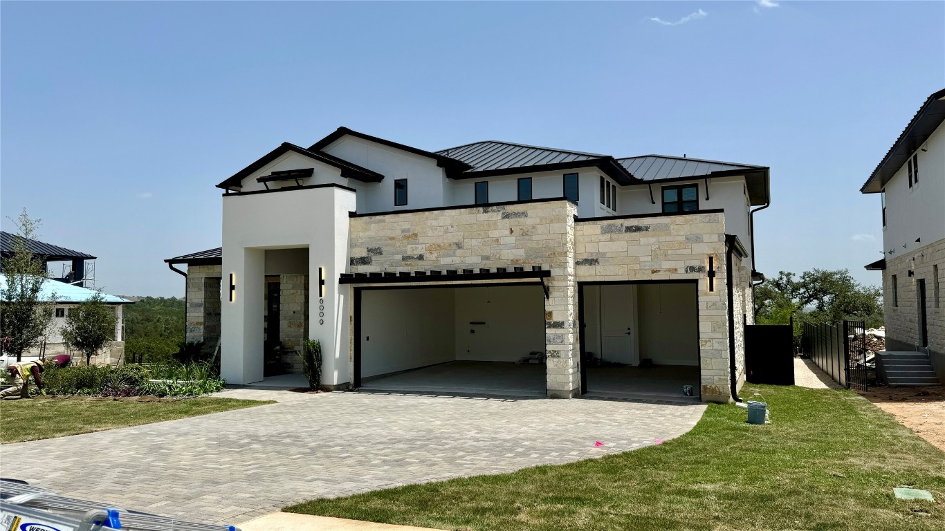 a front view of a house with yard