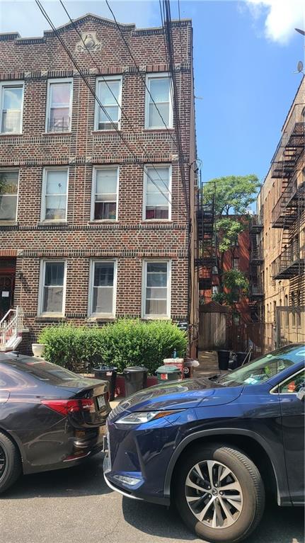 a view of street with parked cars